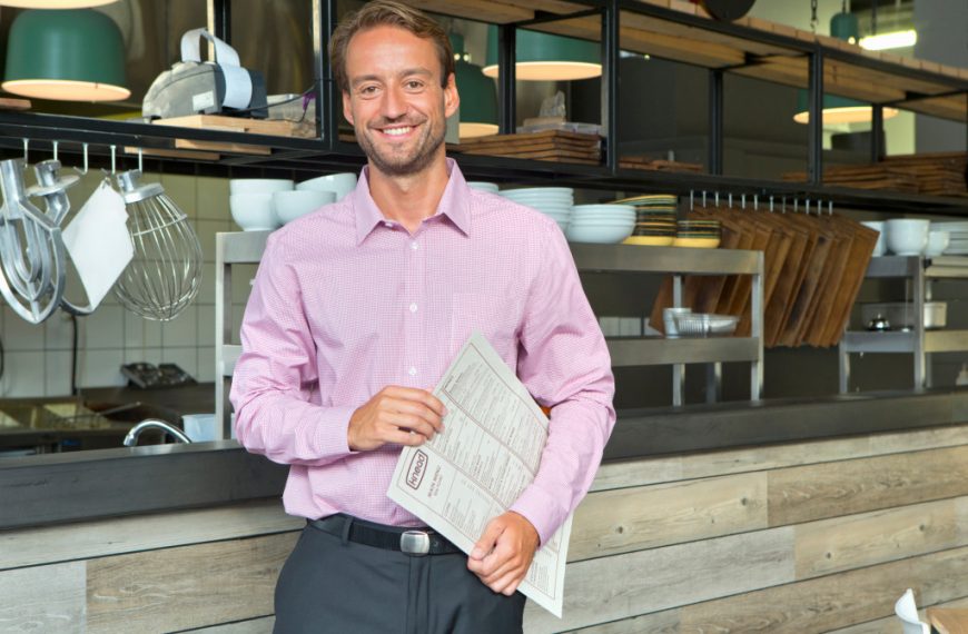 man holding a menu of the restaurant